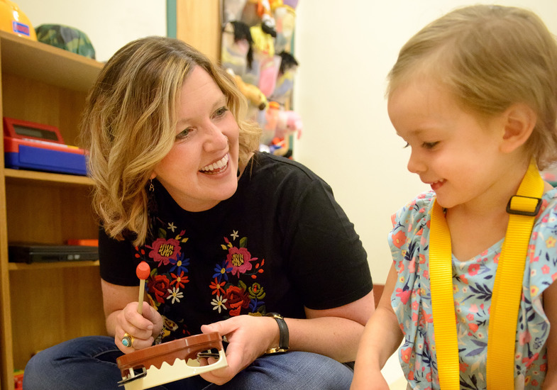 A UW student works at an internship with early childhood development as part of career services.
