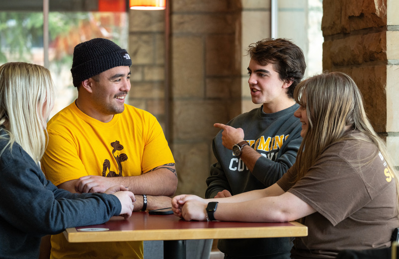 students gathered at a table