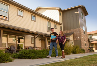 Two UW students walk from nearby apartments to class on campus.