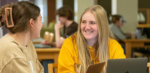 two sstudents in the library