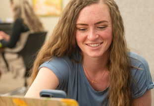 student works on laptop