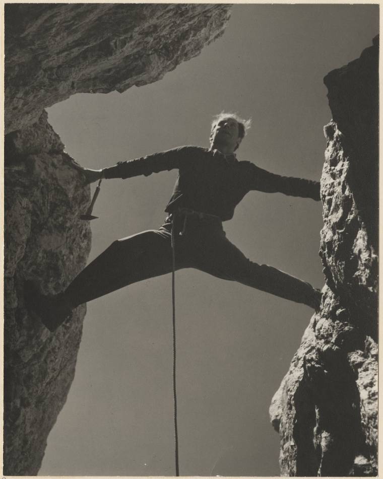 Black and white photograph. Caption reads: "Paul Petzoldt in chimney on Mt. Owen (just for photography)"