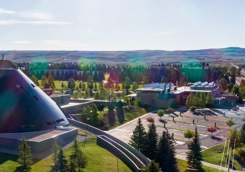 Areal view of the Visual Arts Building and Laramie Mountain Range during summer.