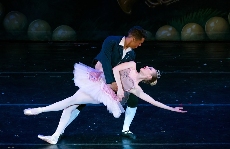 Two ballet dancers perform on the main stage of the theater.