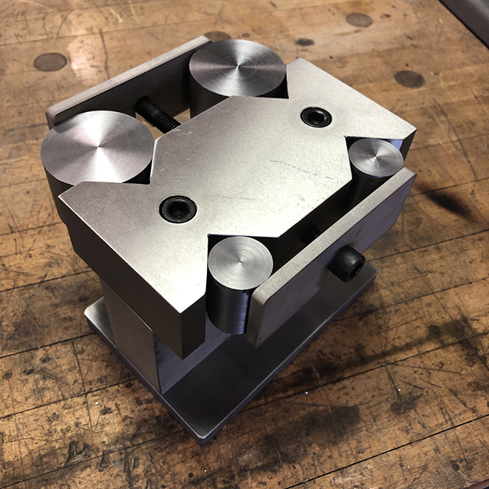 Design build of stainless steel rock core sample holder, WJ cut, machined and ground