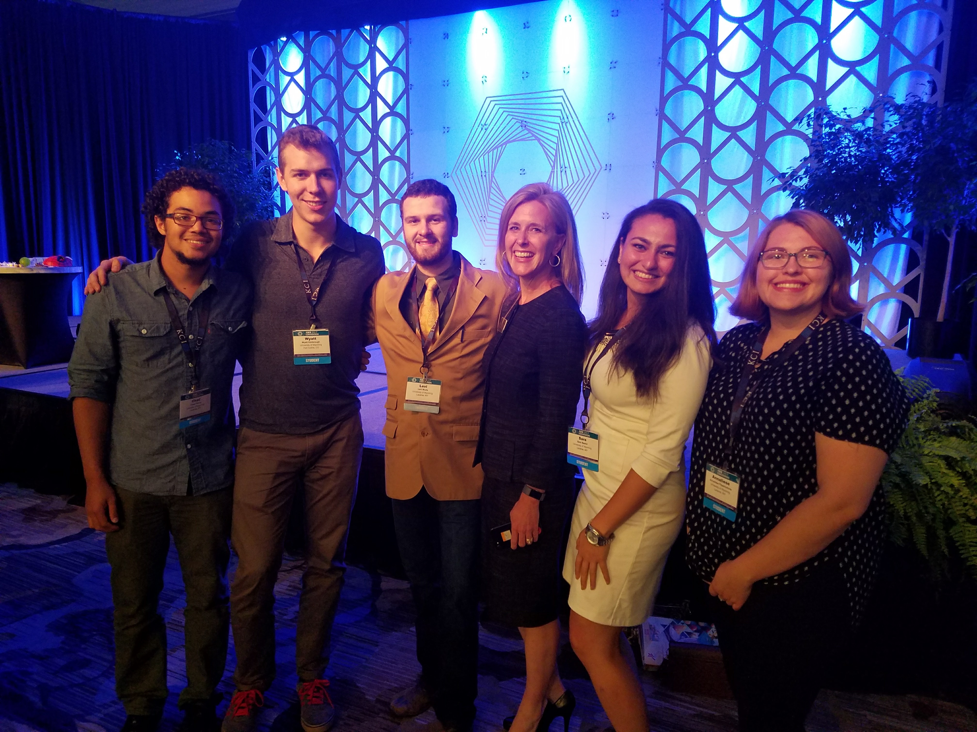 students stand together at an event