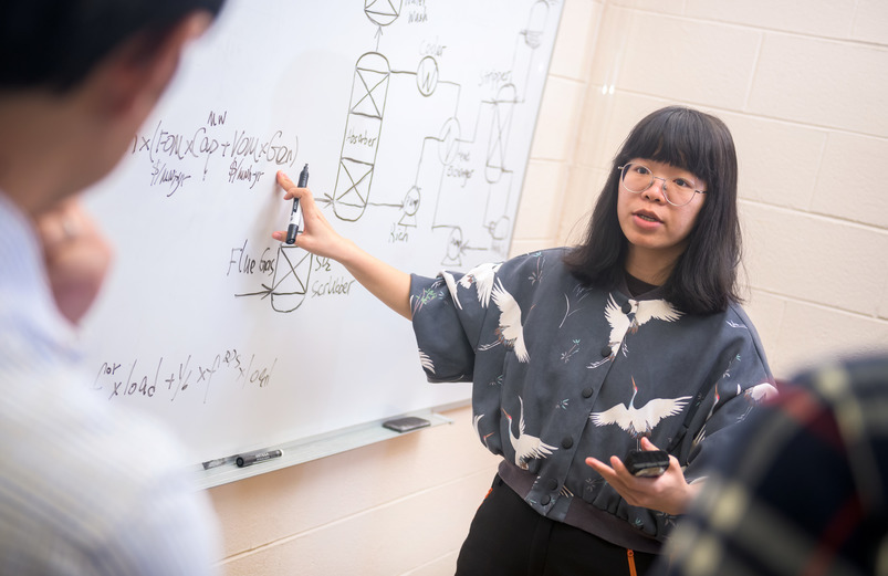 The Department of Civil and Architectural Engineering and Construction Management’s Low-Carbon Energy and Environmental Sustainability (LCEES) lab is fostering multidisciplinary collaborations to address critical challenges concerning our energy supply and use, climate, and the environment. Associate Professor Haibo Zhai, Roy & Caryl Cline Chair of Engineering, Environment and Natural Resources; works with students in his lab...Graduate students: Wanying Wu from China (glasses, grey shirt with swans)