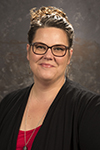 Head and shoulders of Heather Gibson, Office Associate, Senior with UW Speech and Hearing Clinic.