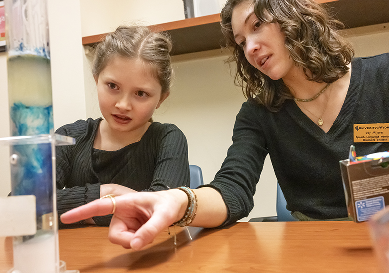 A female student working with a child.