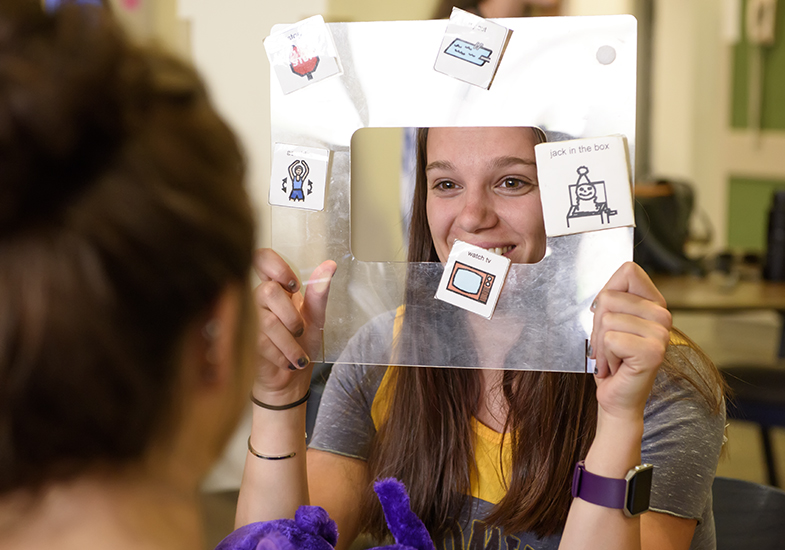 Two students using graphic design promps.