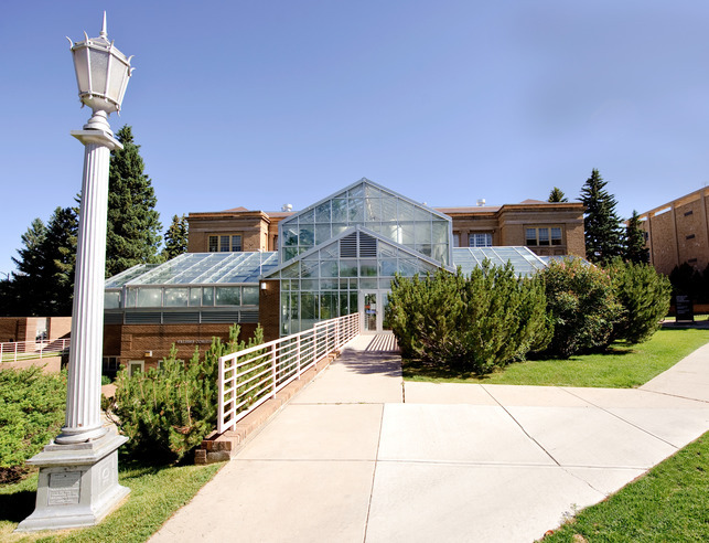 Southern view of williams conservatory from the outside on a sunny day with blue skies