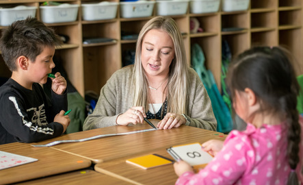 education student working with two youths