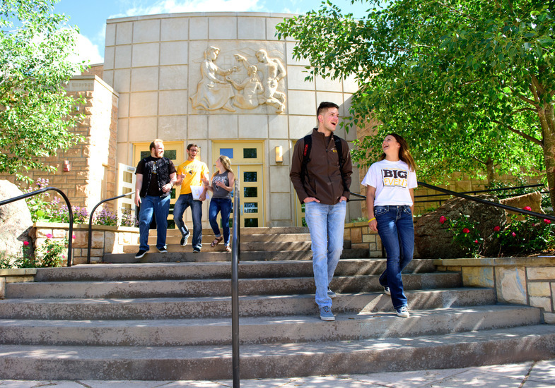 students walking out of the College of Education