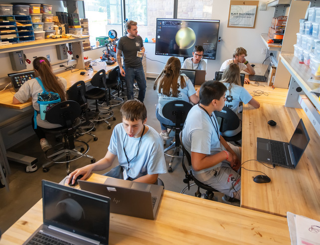 A group of 7-12th grade students participate in the makerspace lab as part of the Gear Up Summer program