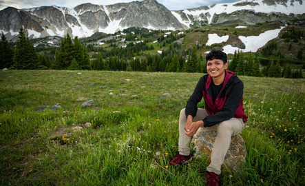 student in front of Medicine Bow Peak