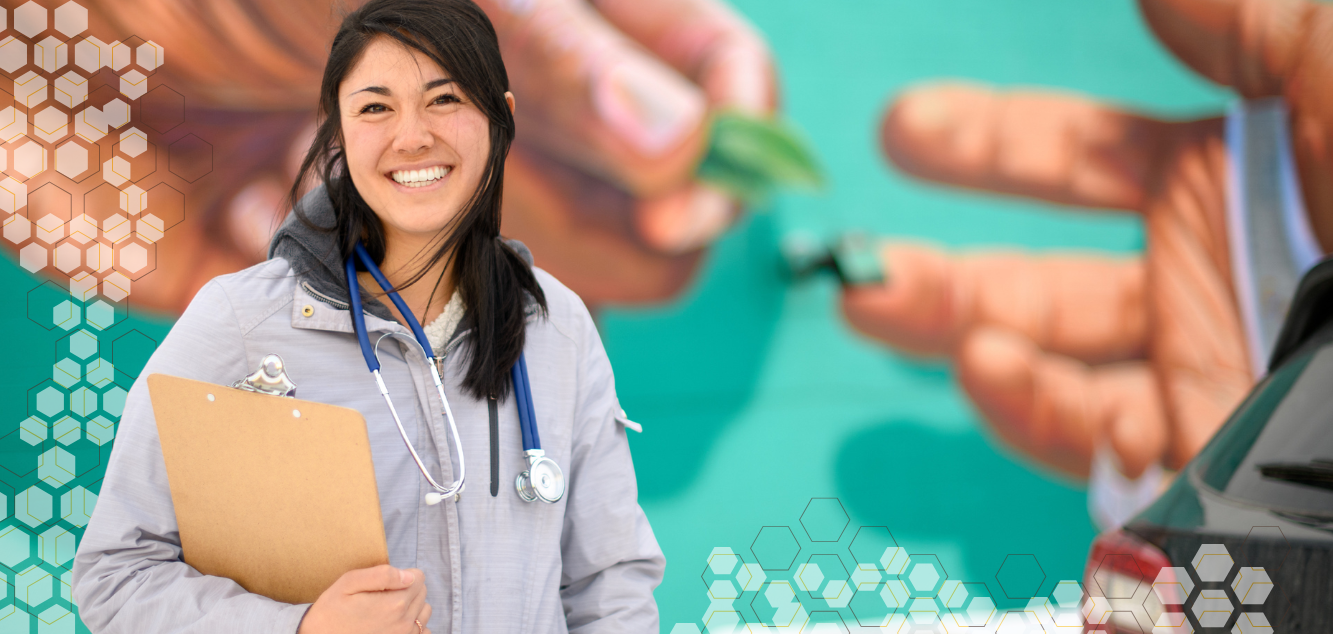 Nursing student in front of Laramie mural