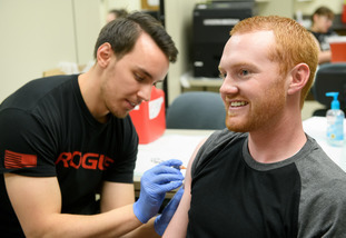 professional admistering a vaccine