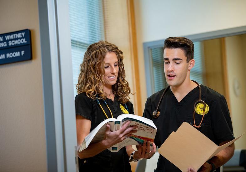 two nursing student review a file