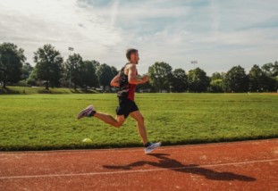 A person running on a track.