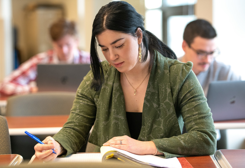 A student writing notes.