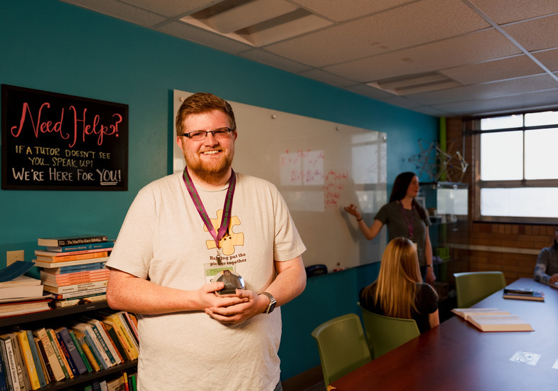 A math tutor smiles for a photo