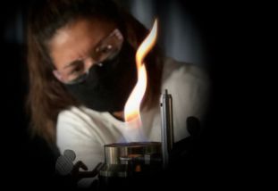 graduate student conducting experiments in combustion