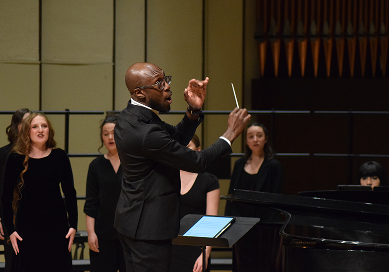 Choral director Dr. O'Neil Jones conducting