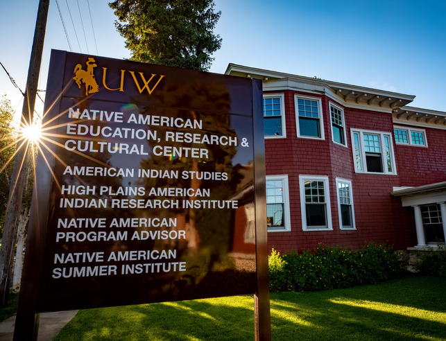 NAERCC house with sign in front and sunshine