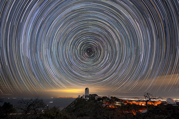 wheel of star trails in the night sky