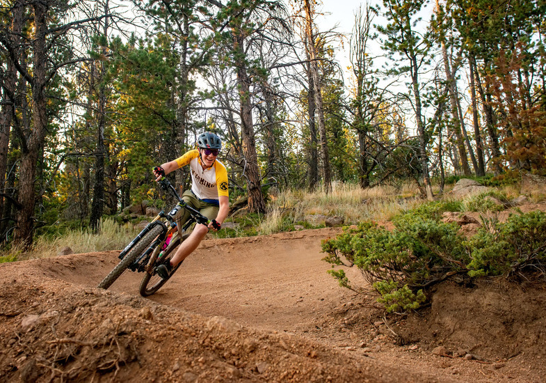 A University of Wyoming student mountain bikes as an outdoor activity in a nearby outdoor recreation area