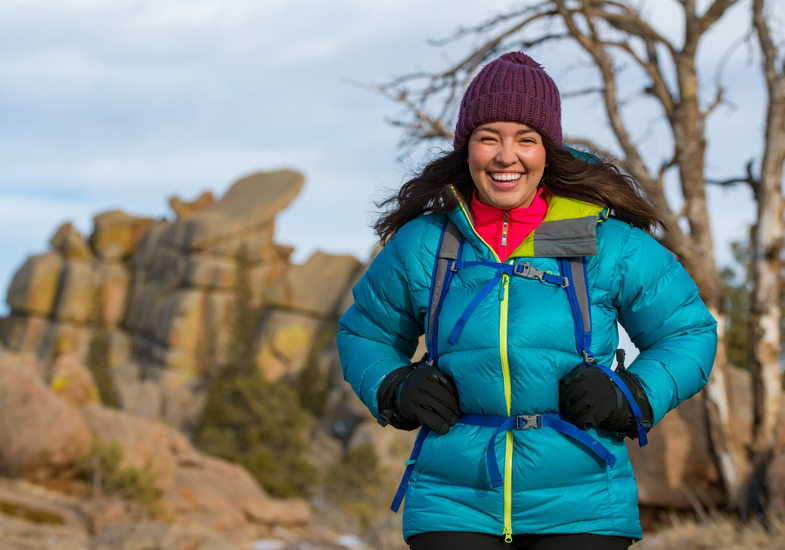 A UW student smiles as they hike through a nearby outdoor recreation area