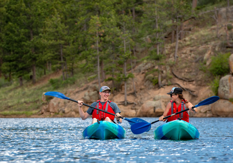 Two UW students kayak in a nearby outdoor recreation area