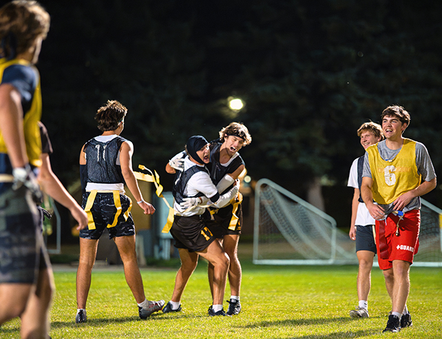 Students celebrate a good play in an Intramural Flag Football contest