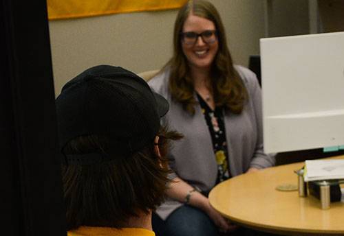 academic director advising a student in the office