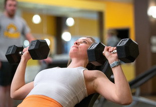 UW student lifts weights at Half Acre