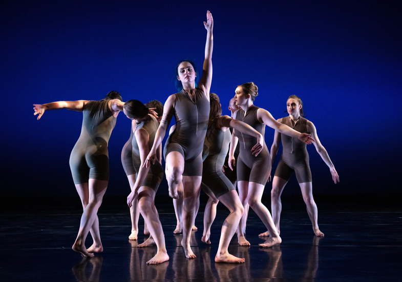 A group of UW student dancers on stage performing