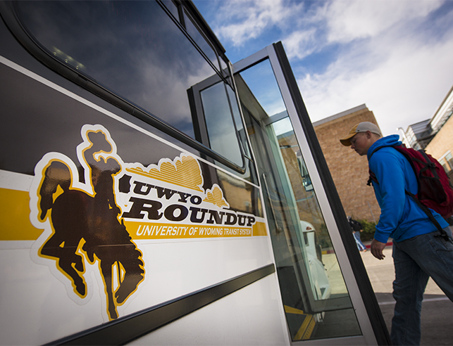 Passengers getting of UWYO Roundup Bus