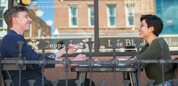 happy people sitting outside a cafe in downtown Laramie