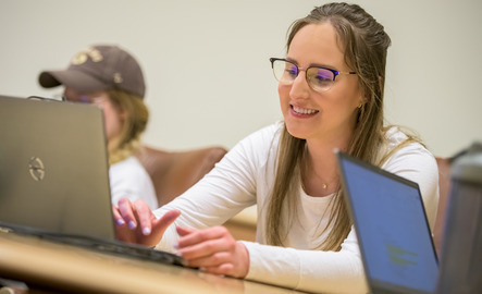 A student working on laptop computer
