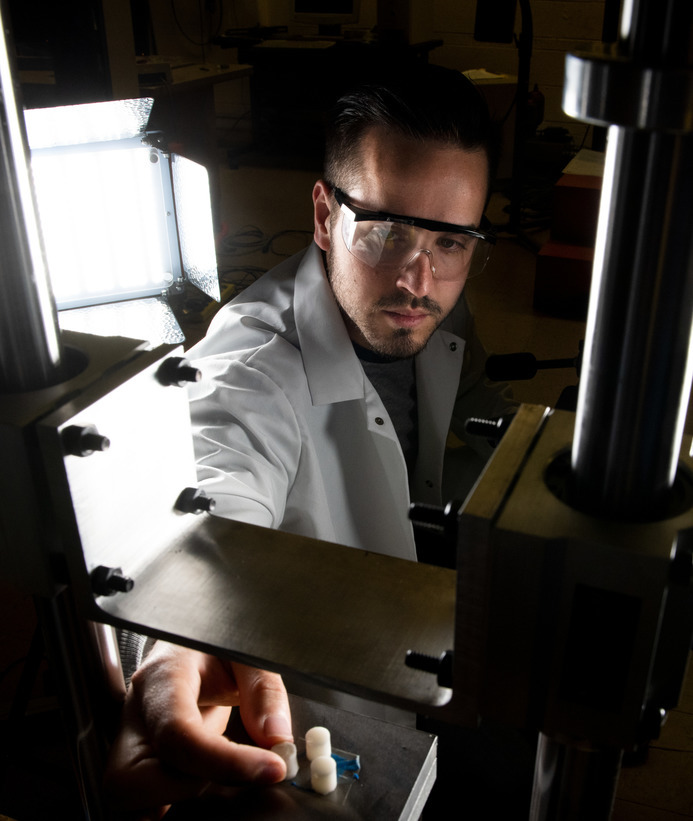 A mechanical engineer works in a lab