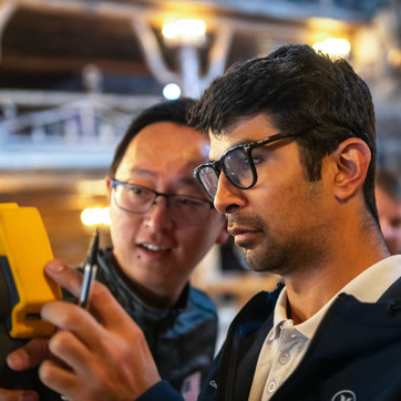 Two students look at information on an engineering tool