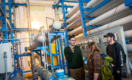 UW students listen to a study abroad educator during an on-site lesson.