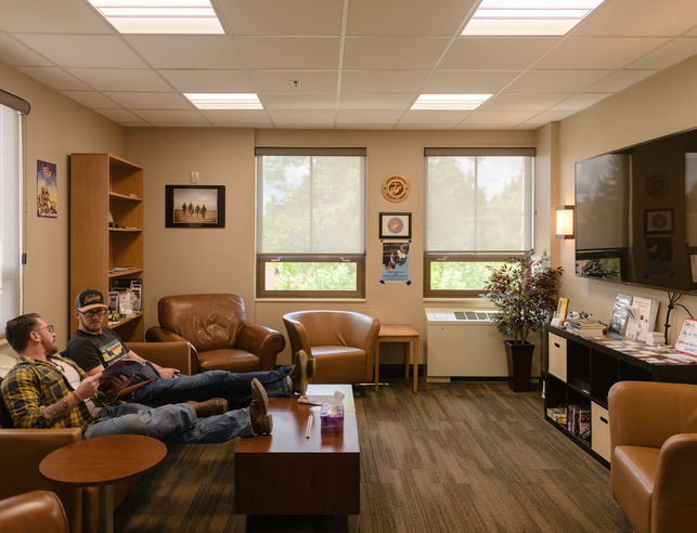 Veterans sitting on a couch in the Veterans Center