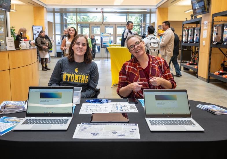 Two staff members table at an event